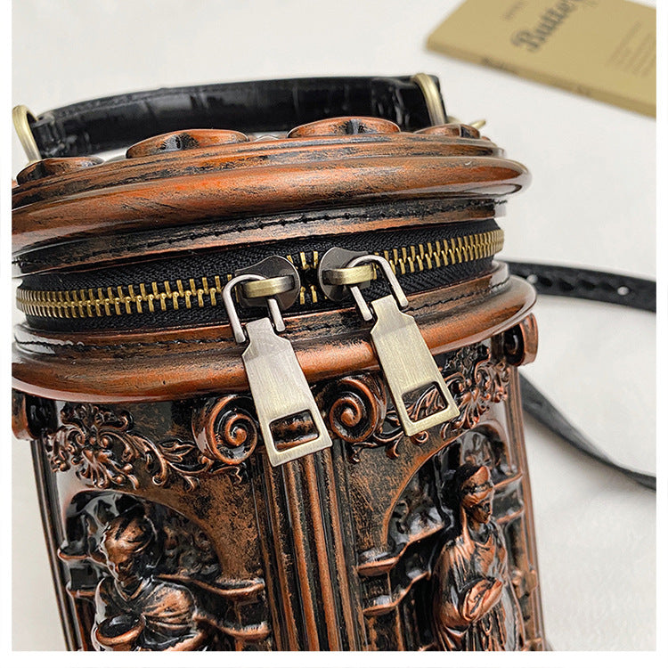 Baroque-style bucket bag with 3D relief detailing
