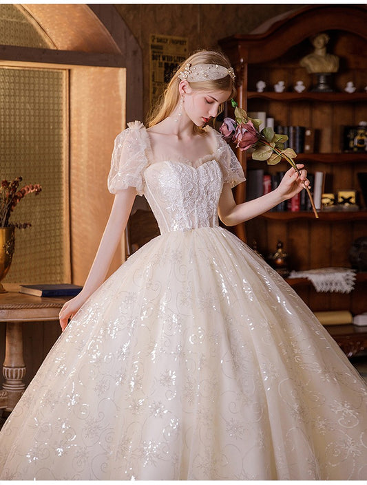 Ethereal shimmering puff sleeve evening gown with sequin embroidery