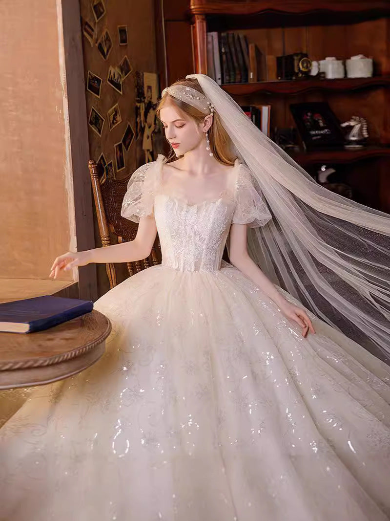 Ethereal shimmering puff sleeve evening gown with sequin embroidery