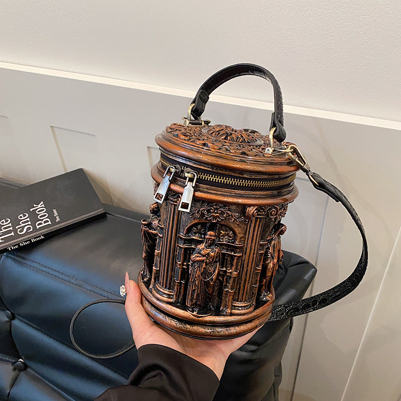 Baroque-style bucket bag with 3D relief detailing