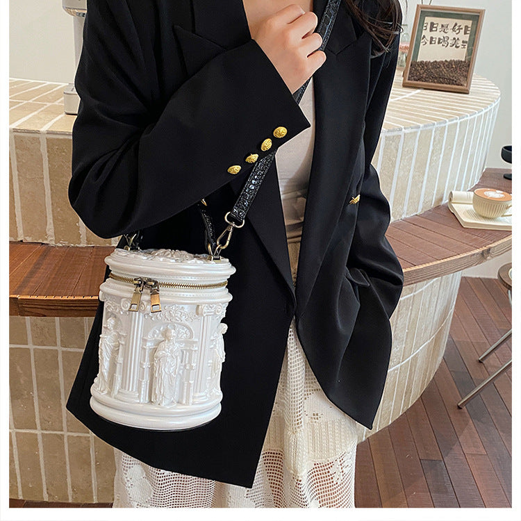 Baroque-style bucket bag with 3D relief detailing