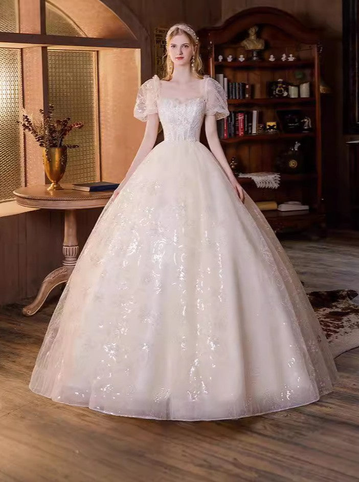 Ethereal shimmering puff sleeve evening gown with sequin embroidery