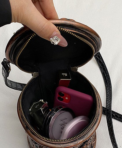 Baroque-style bucket bag with 3D relief detailing