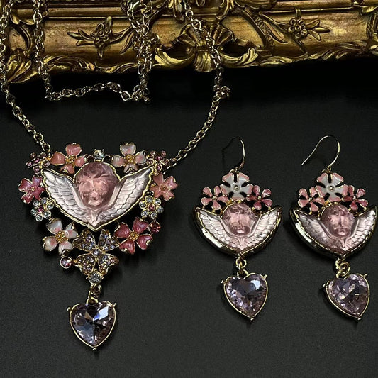 Vibrant jewelry set with pink gemstones and angelic designs, vintage jewelry, vintage necklace, vintage earrings