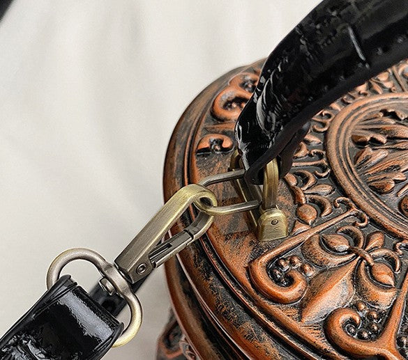 Baroque-style bucket bag with 3D relief detailing