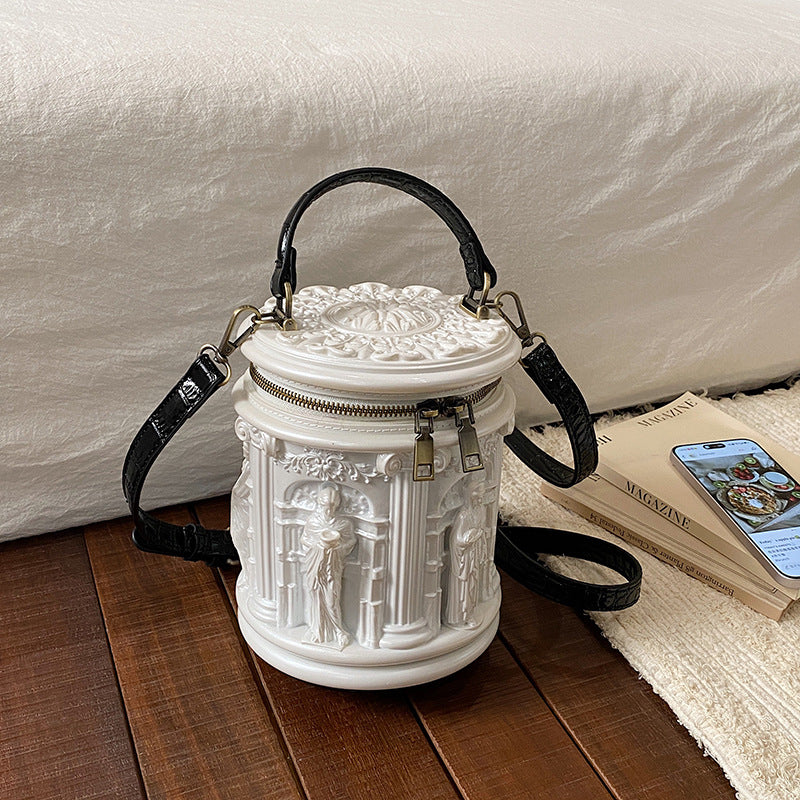 Baroque-style bucket bag with 3D relief detailing