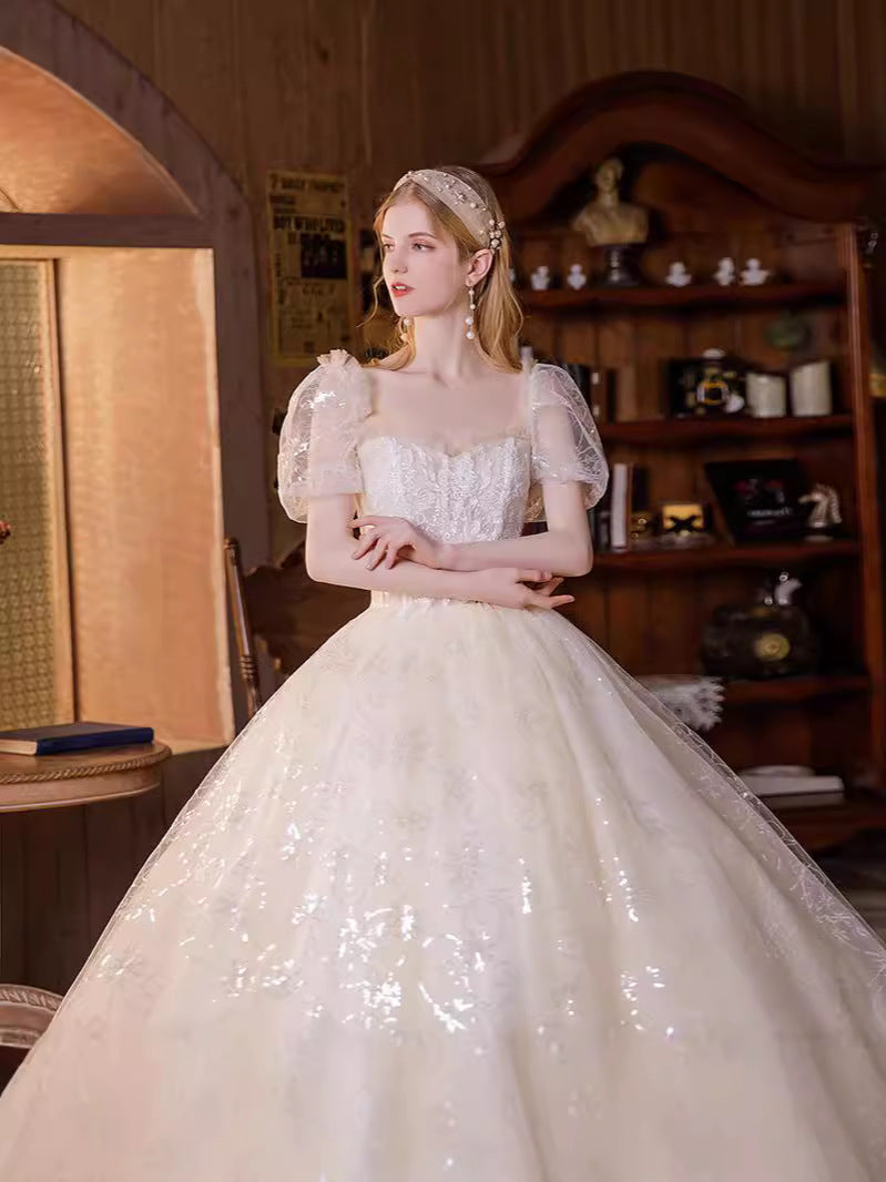 Ethereal shimmering puff sleeve evening gown with sequin embroidery