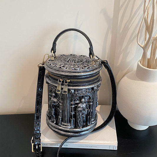 Baroque-style bucket bag with 3D relief detailing