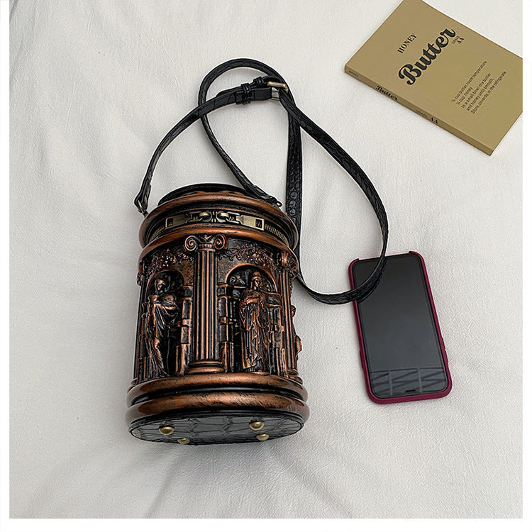 Baroque-style bucket bag with 3D relief detailing